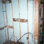 spider installed in back of bath tub unit for sound